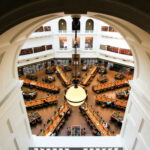 Stunning aerial shot of State Library of Victoria's reading room in Melbourne, showcasing its architecture.
