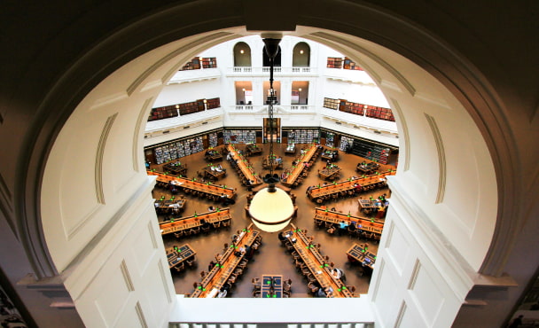 Stunning aerial shot of State Library of Victoria's reading room in Melbourne, showcasing its architecture.